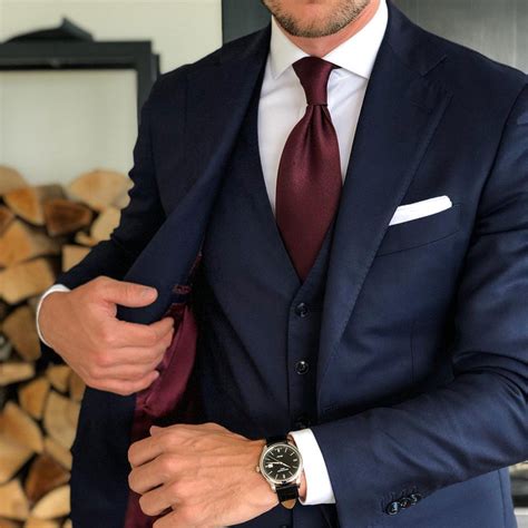 navy suit with burgundy tie.